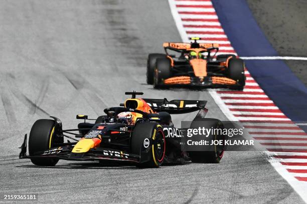 Red Bull Racing's Dutch driver Max Verstappen drives ahead of McLaren's British driver Lando Norris during the Formula One Austrian Grand Prix on the...