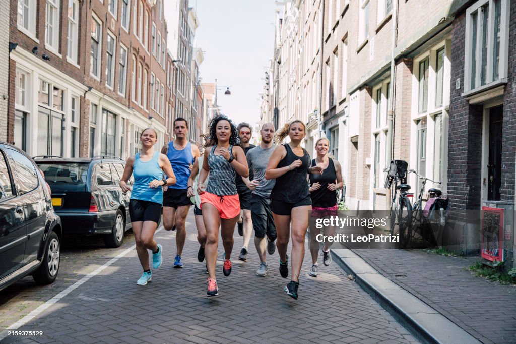 Group of runners training in the city streets