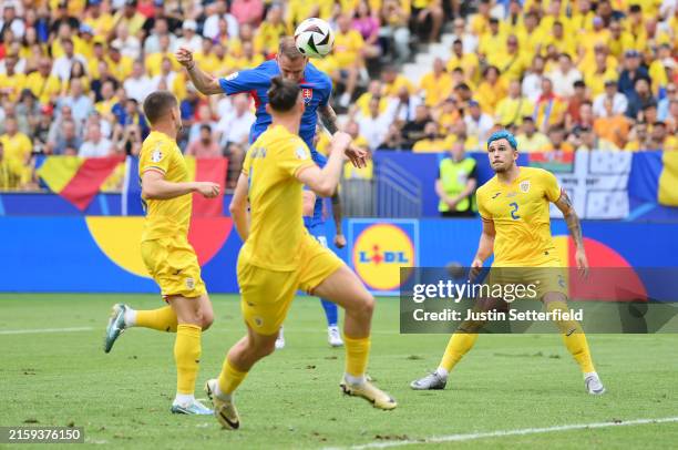 Ondrej Duda of Slovakia scores his team's first goal during the UEFA EURO 2024 group stage match between Slovakia and Romania at Frankfurt Arena on...