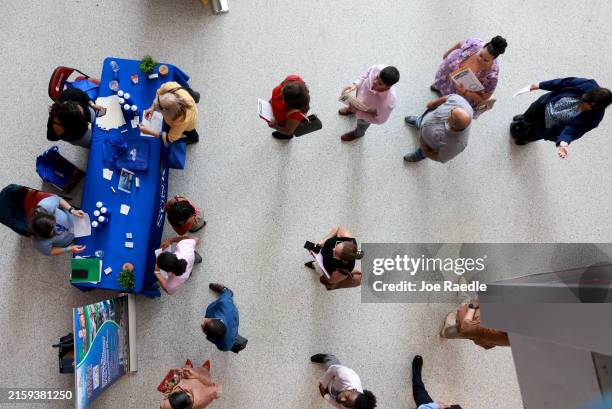 Job seekers attends the JobNewsUSA.com South Florida Job Fair held at the Amerant Bank Arena on June 26, 2024 in Sunrise, Florida. More than 50...