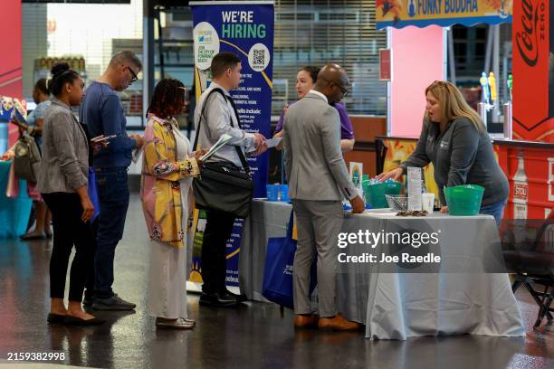 Elizabeth Brunner and Hope Johnson , recruiters for the City of Pompano Beach, speak to job seekers during the JobNewsUSA.com South Florida Job Fair...