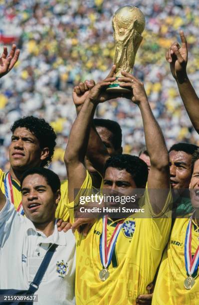 Brazilian footballer Romario celebrates with the trophy after the FIFA World Cup Final, between Brazil and Italy, at the Rose Bowl in Pasadena,...