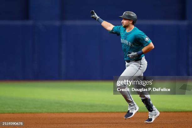 Cal Raleigh of the Seattle Mariners reacts after hitting a three run home run during the sixth inning against the Tampa Bay Rays at Tropicana Field...