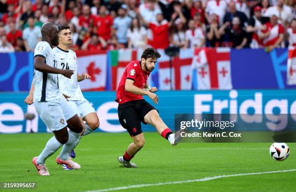 Khvicha Kvaratskhelia of Georgia scores his team's first goal during the UEFA EURO 2024 group stage match between Georgia and Portugal at Arena...