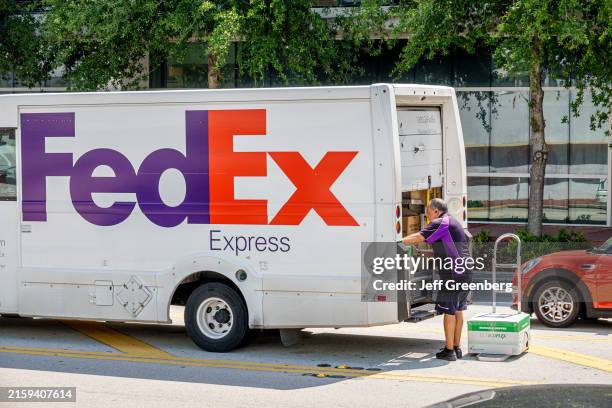 Miami Beach, Florida, FedEx Express delivery van parked, driver... News ...
