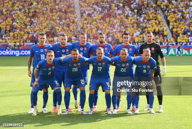 The Slovakia team line up for a picture before the UEFA EURO 2024 group stage match between Slovakia and Romania at Frankfurt Arena on June 26, 2024...