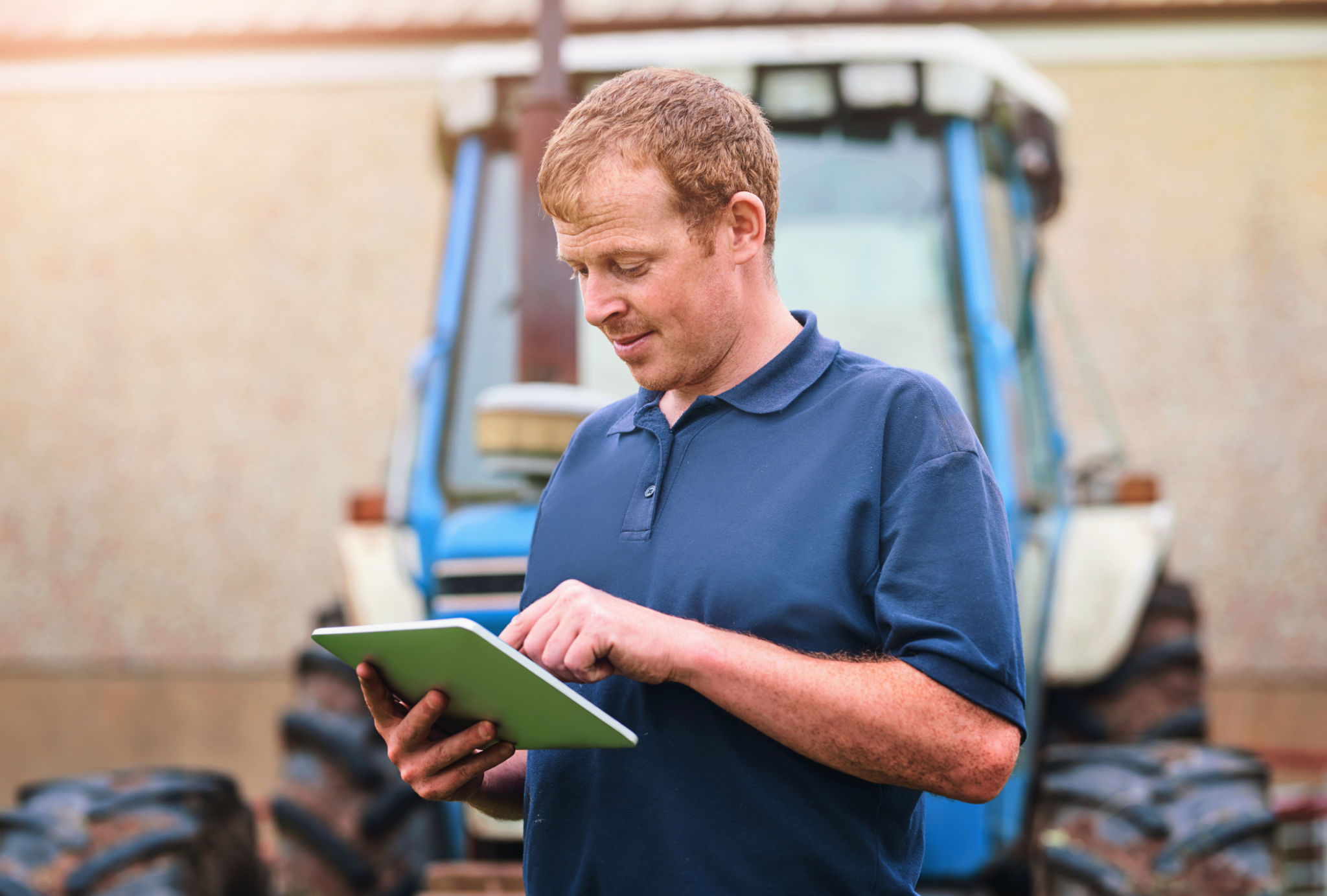 Production, farmer and man with tablet by tractor for schedule, checklist and research on industry. Farming, website and male person with tech for agriculture, agro app and reading weather info Production, farmer and man with tablet by tractor for schedule, checklist and research on industry. Farming, website and male person with tech for agriculture, agro app and reading weather info