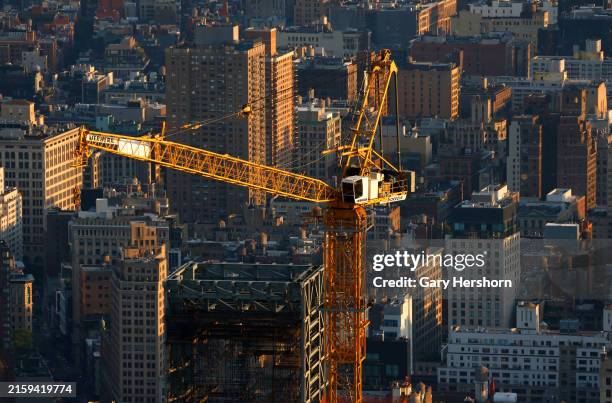 Construction crane stands above 262 Fifth Avenue in midtown Manhattan as seen from the 86th-floor observation deck of the Empire State Building on...