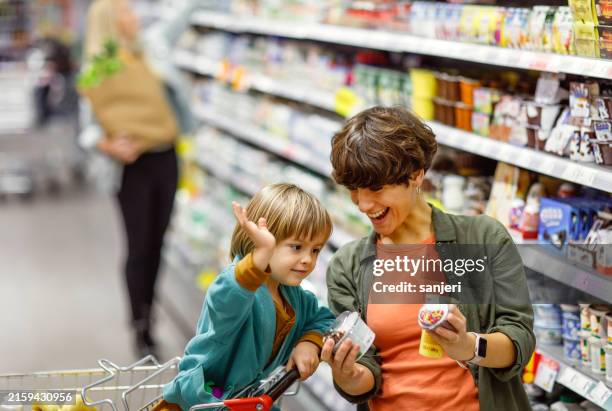 family grocery shopping adventure - market retail space stock pictures, royalty-free photos & images