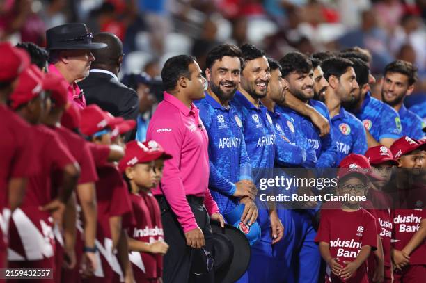 Rashid Khan of Afghanistan reacts during national anthems prior to the ICC Men's T20 Cricket World Cup West Indies & USA 2024 Semi-Final match...