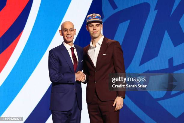 Nikola Topic shakes hands with NBA commissioner Adam Silver after being drafted 12th overall by the Oklahoma City Thunder during the first round of...