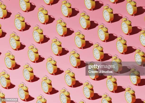 grid pattern of alarm clocks - väckarklocka bildbanksfoton och bilder