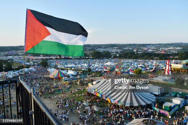 Palestine flag flies from the ribbon tower during day one of Glastonbury Festival 2024 at Worthy Farm, Pilton on June 26, 2024 in Glastonbury,...