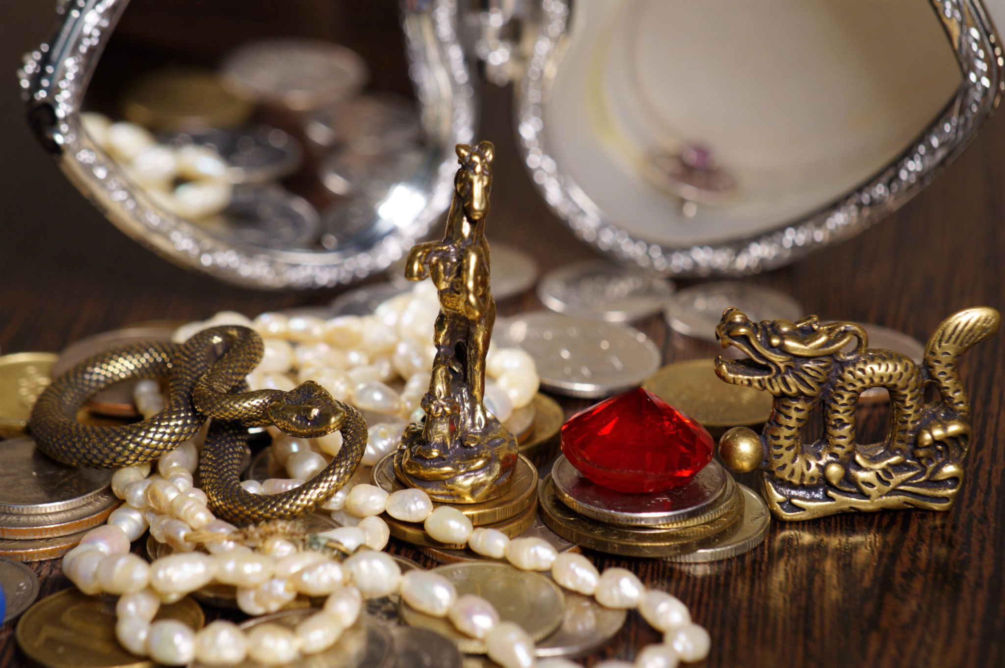 A statuette of a snake, a horse and a dragon. A statuette of a snake, a horse and a dragon.