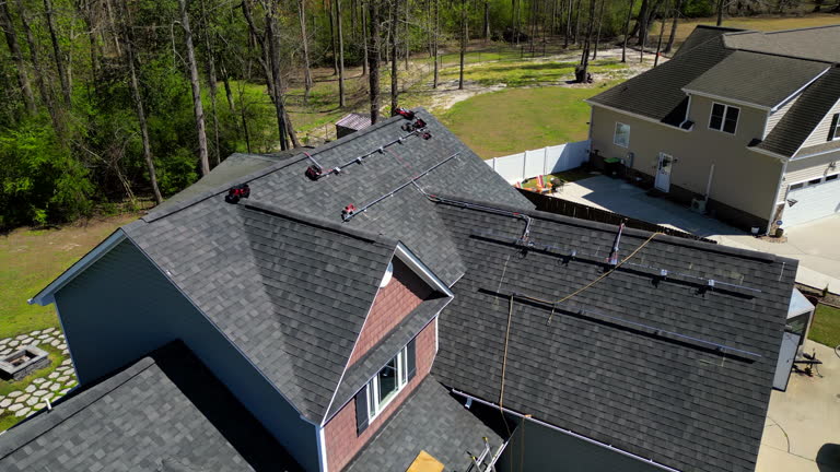 https://media.gettyimages.com/id/2159530339/video/solar-panels-private-home-install-sustainable-energy-mounting-rails-drone-close-up-roof-orbit.jpg?b=1&s=640x640&k=20&c=0zPZboybeL_v3Xi_VyuqIJyPovzWw3lMW96xbmDjeow=