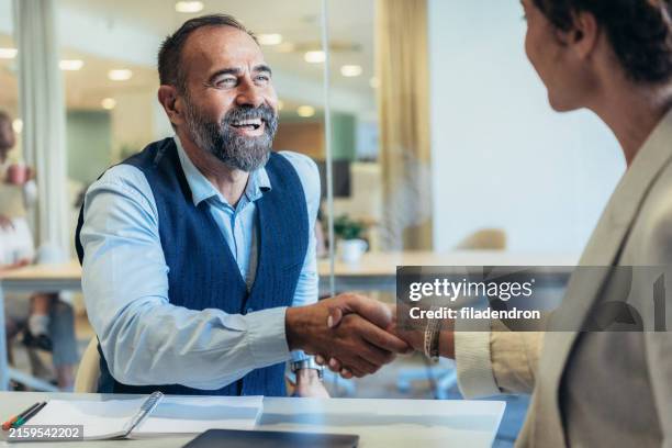 handshake for the new agreement - old and new computer stock pictures, royalty-free photos & images