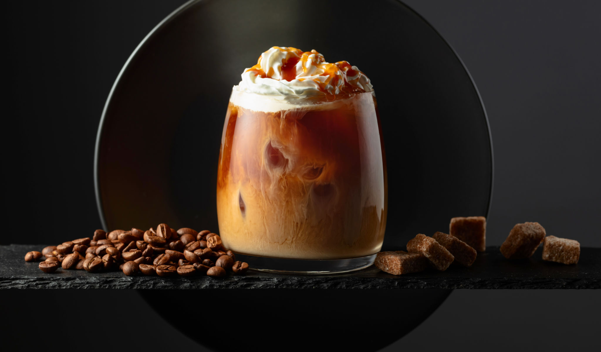 Iced coffee with whipped cream and caramel sauce. Iced coffee with whipped cream and caramel sauce.