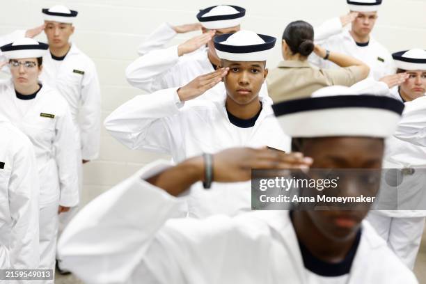 Incoming plebes learn how to wear their covers during Induction Day at the U.S. Naval Academy on June 27, 2024 in Annapolis, Maryland. Around 1,200...