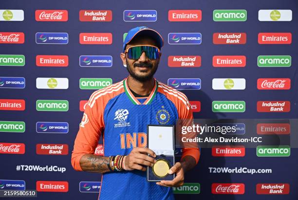 Axar Patel of India with his Player of the Match award after the ICC Men's T20 Cricket World Cup West Indies & USA 2024 Semi-Final match between...