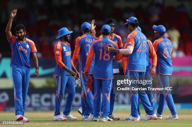 Players of India celebrate their side's victory in the ICC Men's T20 Cricket World Cup West Indies & USA 2024 Semi-Final match between India and...