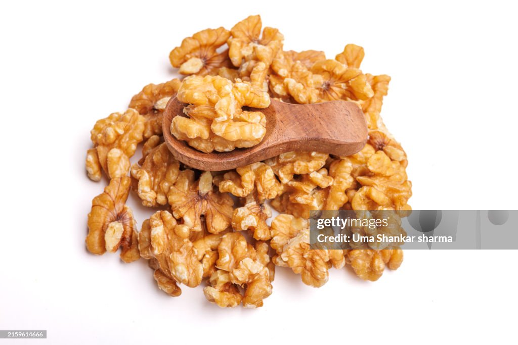 Peeled Walnuts stack Isolated On White Background.
