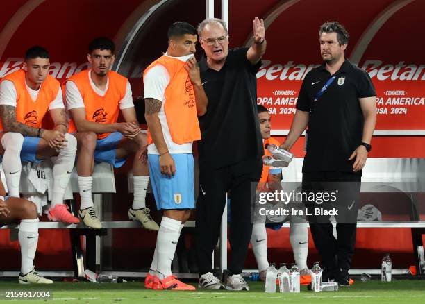Marcelo Bielsa, Head Coach of Uruguay talks to his player Luis Suarez of Uruguay during the CONMEBOL Copa America 2024 Group C match between Uruguay...