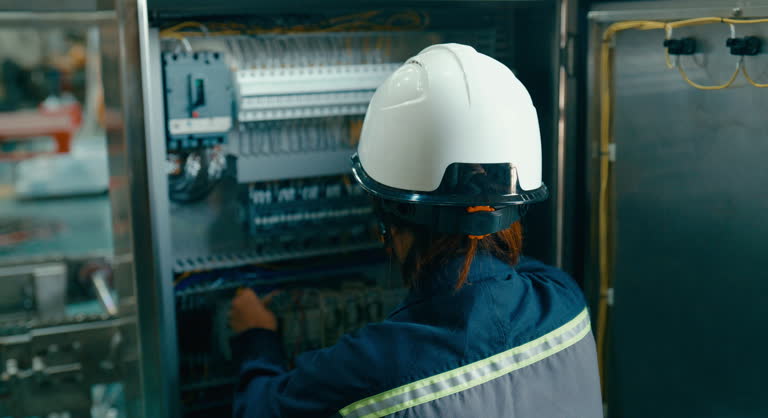 https://media.gettyimages.com/id/2159617821/video/young-asian-female-technician-in-factory-adjusting-and-examining-an-electrical-control-panel.jpg?b=1&s=640x640&k=20&c=8BXrbSGhojClUUGdzPZBmZA5chmdeIaXowFkyUEAp4A=