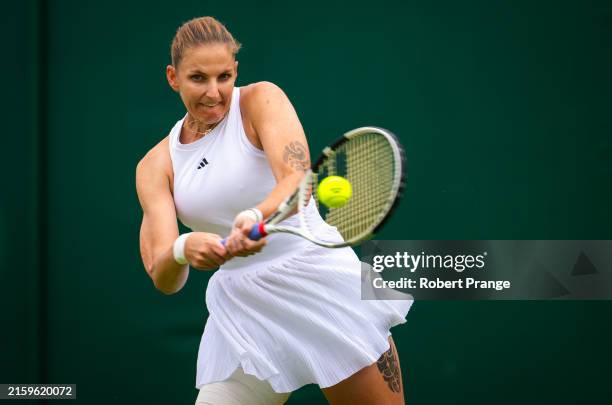 Karolina Pliskova of the Czech Republic in action against Diana Shnaider in the first round on Day One of The Championships Wimbledon 2024 at All...