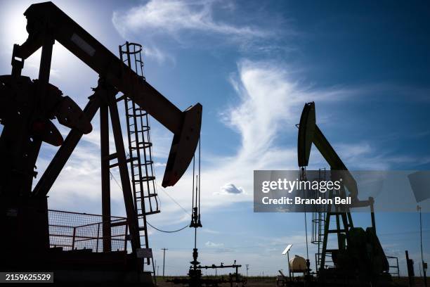 Oil pump jacks are shown in a field on June 27, 2024 in Stanton, Texas. Crude oil prices gained 1% after continued fears of global crude supply...