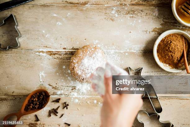 woman preparing cookie dough for christmas sweets - kneading stock pictures, royalty-free photos & images