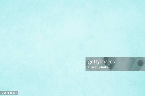 Pastel blue and white concrete stone texture for background in summer wallpaper. Cement and sand wall of tone vintage. Decorative abstract wall of light cyan color painted, Beautiful mint green decor.