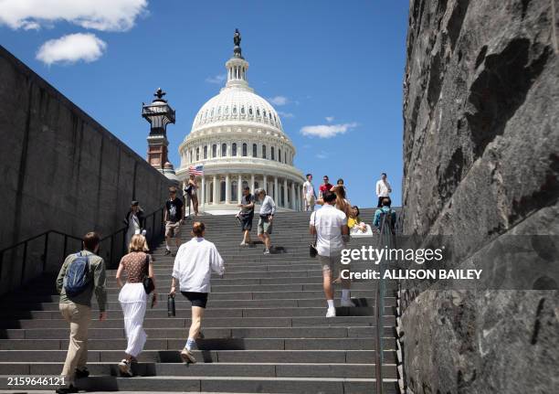 Tourists visit the U.S. Capitol as the Supreme Court issues the last remaining opinions of the term, including a decision on Donald Trump's immunity...