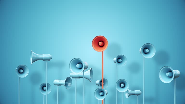 https://media.gettyimages.com/id/2159655693/video/megaphones-rising-from-the-bottom-of-the-frame-with-a-red-colored-one-standing-out.jpg?b=1&s=640x640&k=20&c=P3KA7_T6FNrkOk4nuuxZUKmh6XdbrIHLiEcQl6d6rg0=
