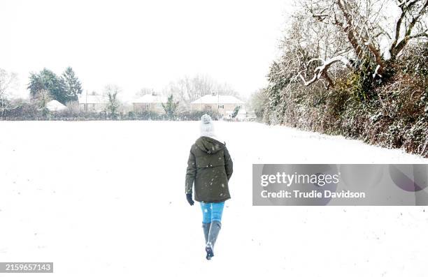 girl in snow - snowing stock pictures, royalty-free photos & images