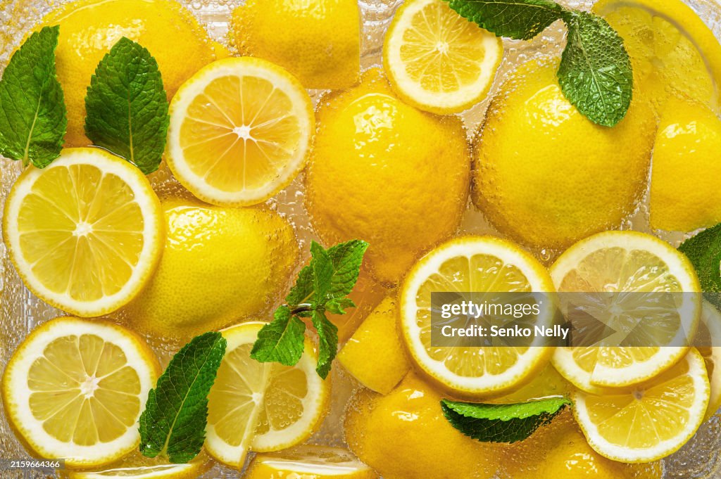 Summer refreshing lemonade. Lemon and mint slices close-up