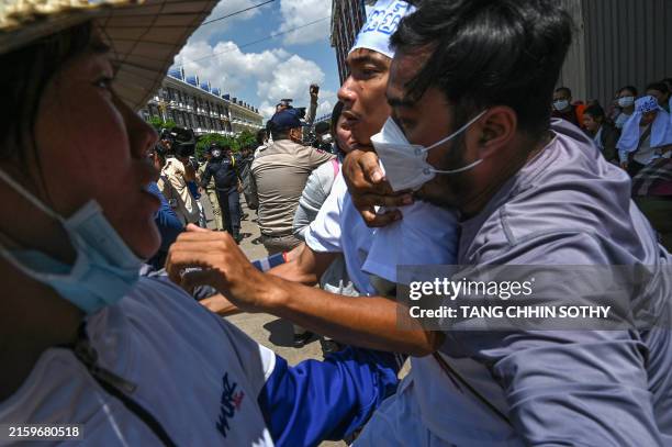 Cambodian environmental activist Ly Chandraravuth is arrested outside Phnom Penh municipal court after a verdict in Phnom Penh on July 2, 2024. A...