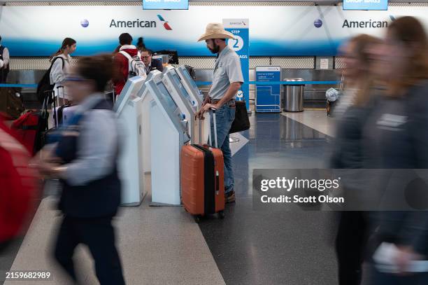 Passengers pass through O'Hare airport during the start of the Independence Day travel week on June 28, 2024 in Chicago, Illinois. With an estimated...