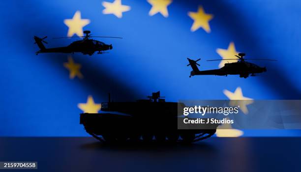 eu flag and military equipment - europaflagge stock-fotos und bilder