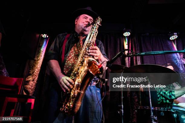 senior man playing saxophone on a live concert - saxophone stock pictures, royalty-free photos & images