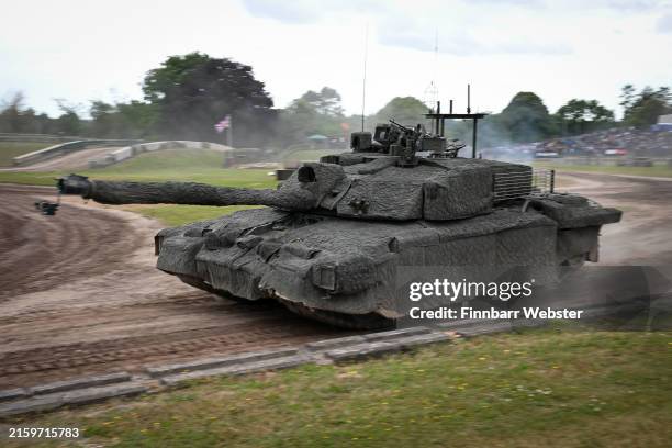 Challenger 2 Main Battle Tank with stealth blanket to shield from radar and heat, in main arena at TANKFEST 2024 at The Tank Museum, on June 28, 2024...