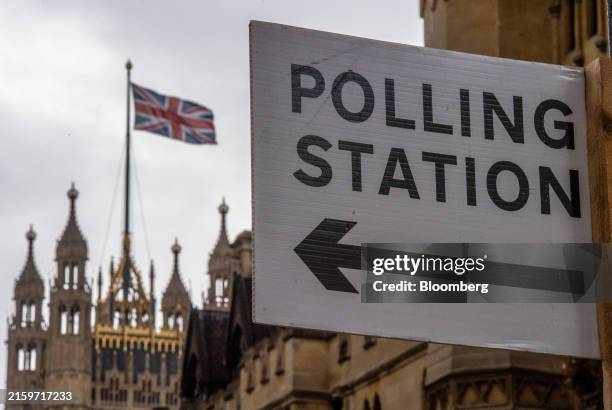 Sign for a polling station near the Houses of Parliament ahead of the UK general election, in London, UK, on Tuesday, July 2, 2024. Prime...