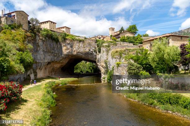 the village of puentedey is located on a natural bridge over the river nela, las merindades, province of burgos, castilla-león, castilla y león, spain. - burgos stock pictures, royalty-free photos & images