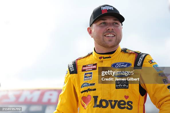Layne Riggs, driver of the Love's Travel Stops Ford, looks on during ...