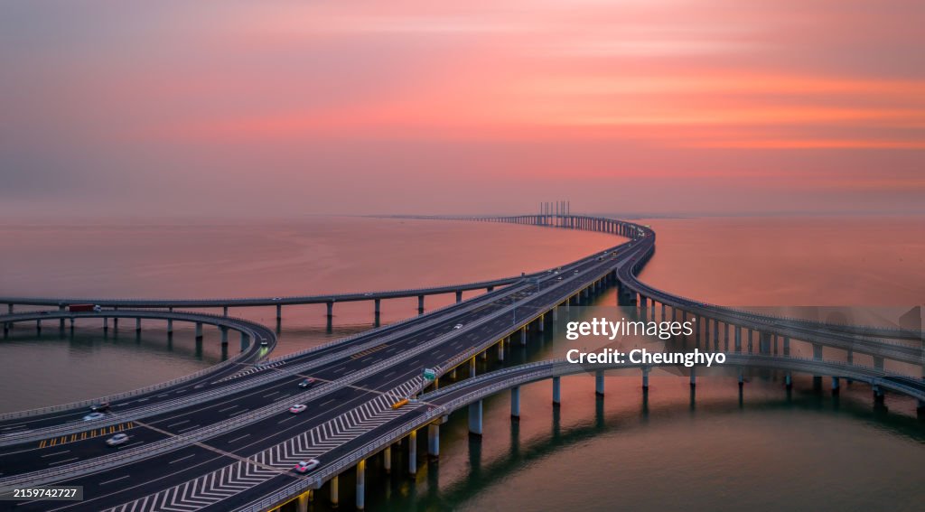Drone Point View of Jiaozhou Bay Bridge at the Colorful Sunset, Qingdao City, Shandong Province, China
