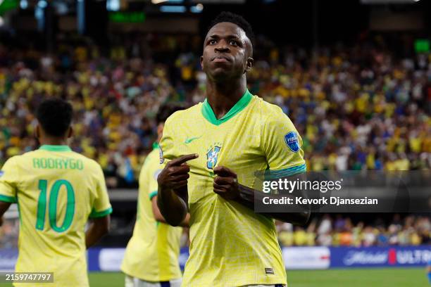 Vinicius Junior of Brazil celebrates after scoring the team's first goal during the CONMEBOL Copa America 2024 Group D match between Paraguay and...