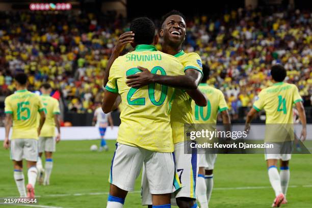 Savinho of Brazil celebrates with teammate Vinicius Junior after scoring the team's second goal during the CONMEBOL Copa America 2024 Group D match...
