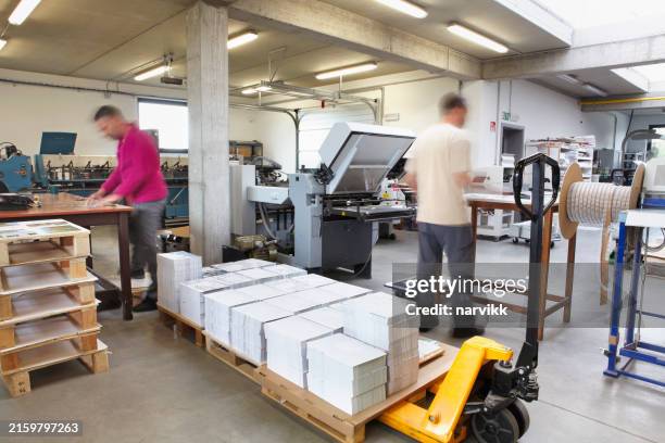 people working in the printshop - printing press stock pictures, royalty-free photos & images