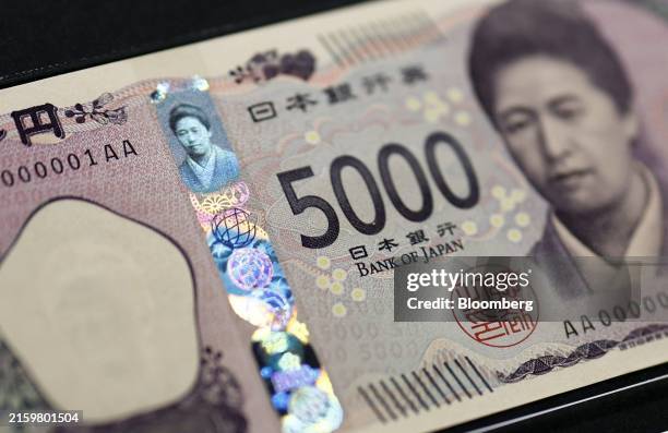 Newly-designed Japanese 5,000 yen banknote, with three-dimensional holographic technology to prevent forgery, displayed at the Bank of Japan Currency...