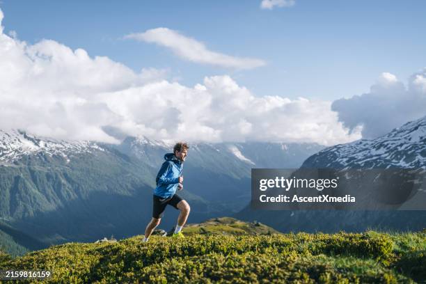 trail runner bounds along mountain trail - haute savoie stock pictures, royalty-free photos & images