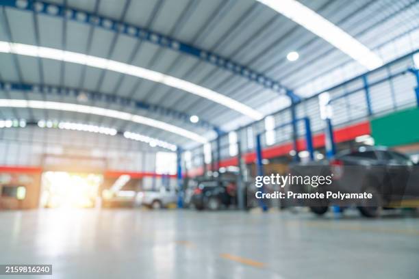 blurred of car repair service center for background. - draped car stock pictures, royalty-free photos & images